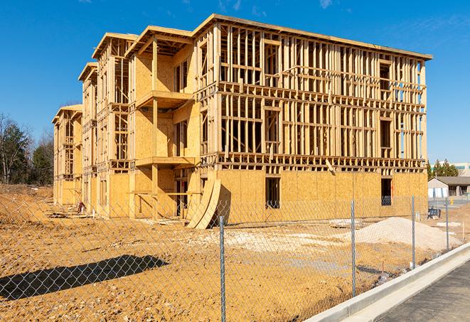 a temporary chain link fence locking away a building under renovation, serving as a security tool in Moreno Valley, CA